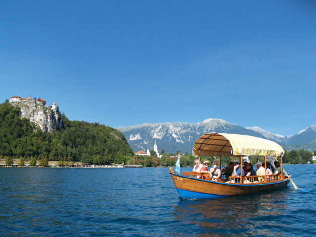 Pletna boat ride at Lake Bled with Bled Castle in the background