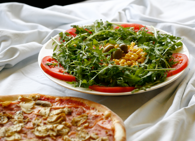 A pizza and a salad served at Pizzeria Rustika in Bled, Slovenia