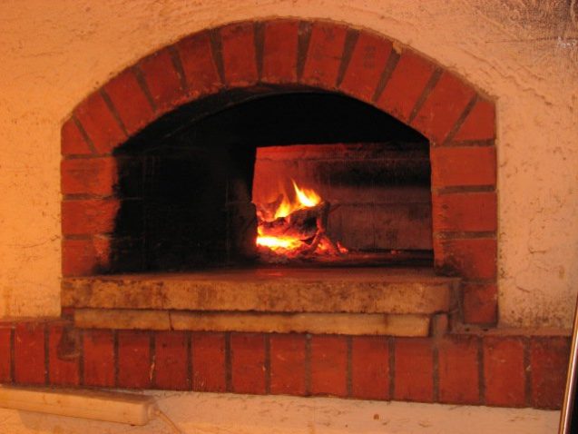 A wood-burning oven at Pizzeria Rustika in Bled, Slovenia