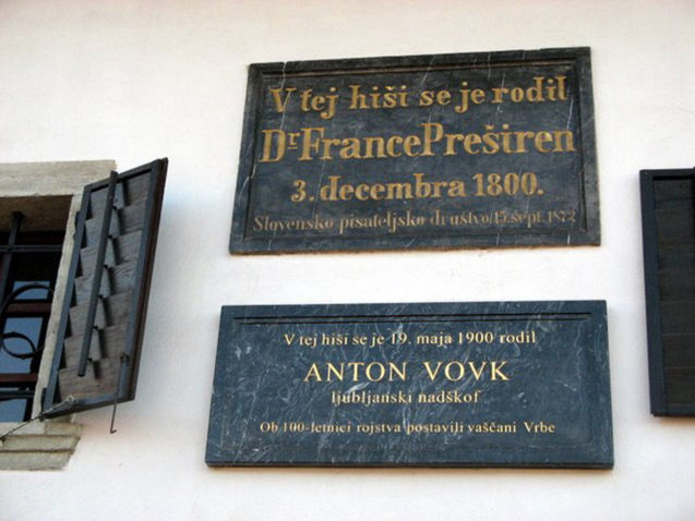 Two memorial plaques are built in the entrance façade, commemorating the birth of France Preseren and Archbishop Anton Vovk.