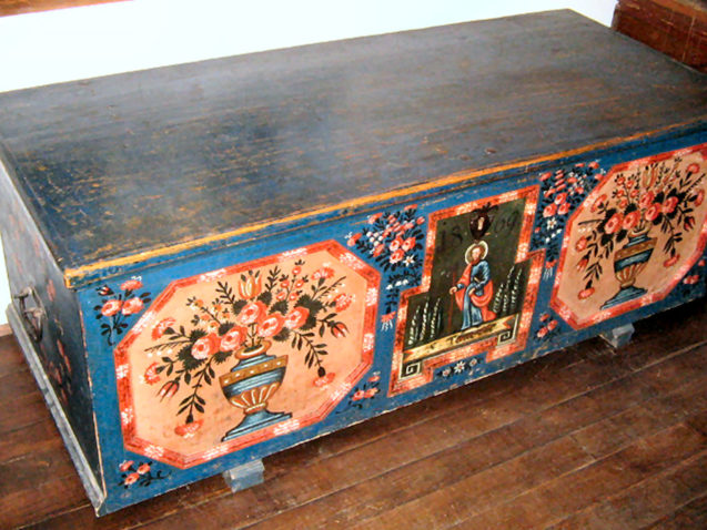 A painted trousseau chest inside Liznjek House in Kranjska Gora