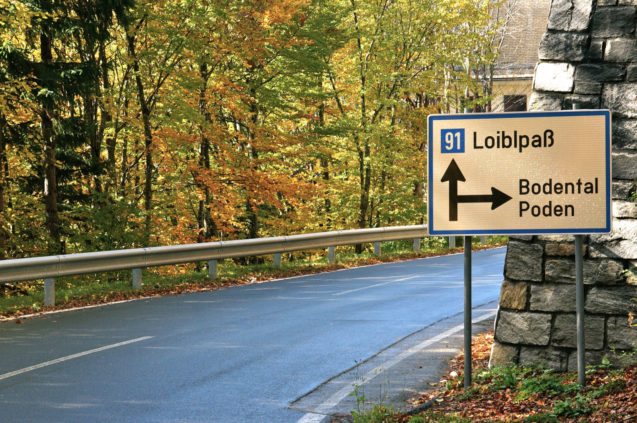 Fingerpost on the Loibl Pass road at the Sapotnica