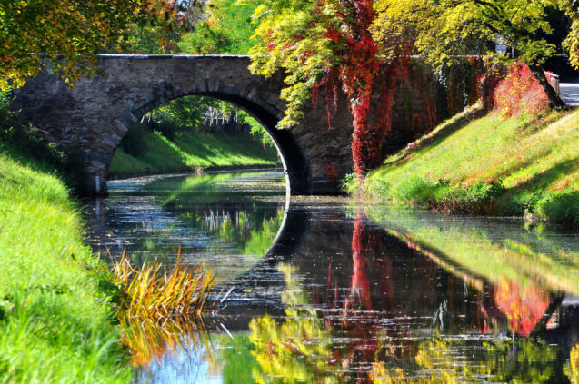 Historic stone bridge across the Lendkanal in Klagenfurt on the Lake Woerth, Carinthia, Austria