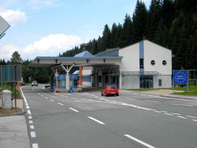 The Austrian sign and border post at the Wurzen Pass