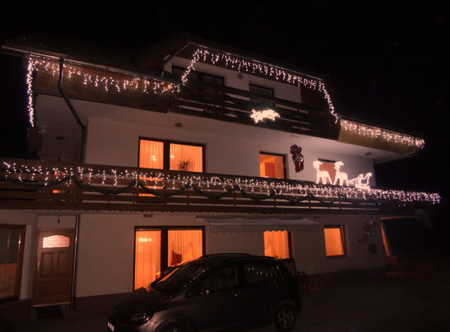 Exterior of the Fine Stay Apartment during the festive season decorated with Christmas lights