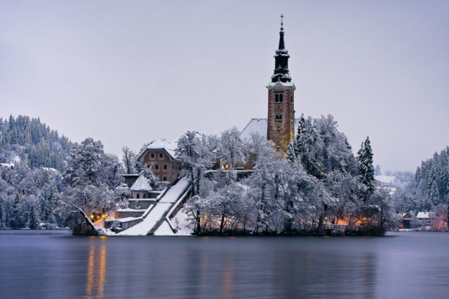 Bled Island on the winter evening with a covering of fresh snow