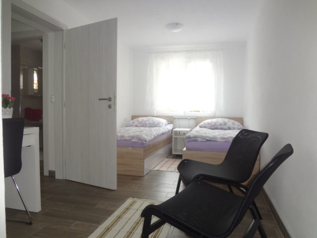 Second bedroom with two single beds in the Fine Stay Apartment, the Bled Area of Slovenia