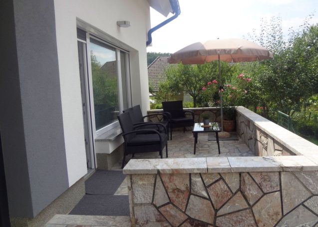 A terrace with garden furniture at Apartments Fine Stay in the Bled area of Slovenia