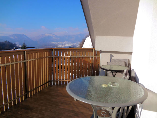 A wintry view towards the Julian Alps from the balcony of Apartments Fine Stay in Slovenia