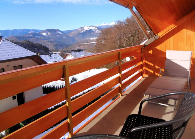 A view of the Slovenian Alps in winter from the balcony of Apartments Fine Stay in Slovenia