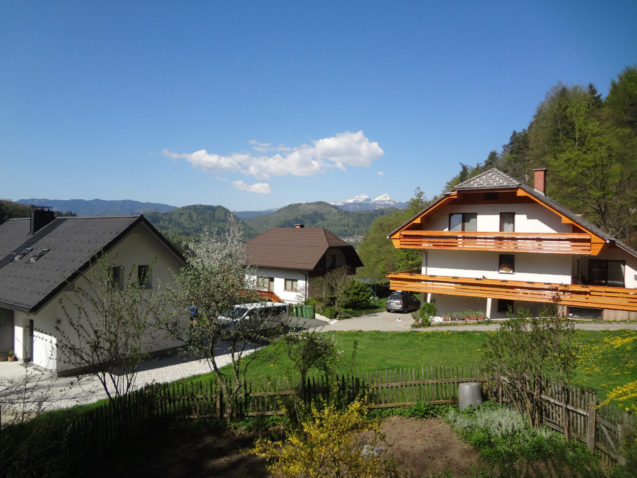 Elevated view of Fine Stay Apartments with Mount Triglav in the background