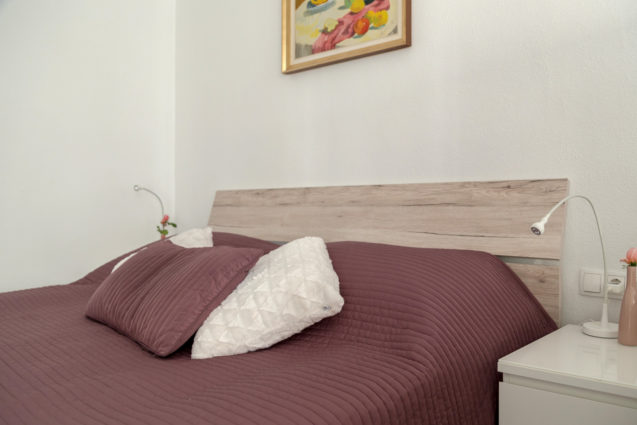 The painting above the bed in the first bedroom of the Modern Apartment With Balcony and Terrace, Apartments Fine Stay