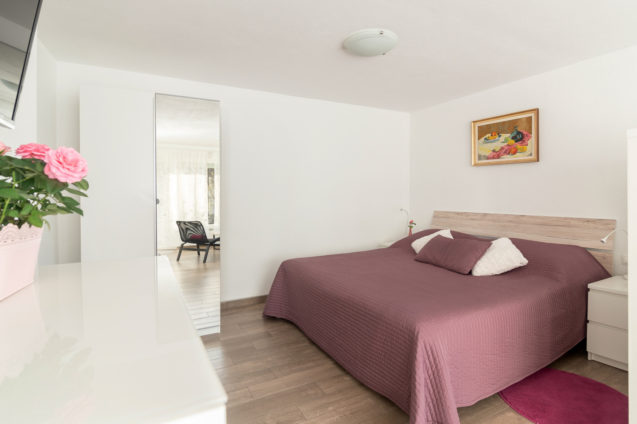 Double bed in the first bedroom of the Modern Apartment With Balcony and Terrace