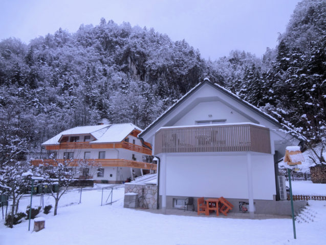 View of Apartments Fine Stay from the snow covered garden in the winter