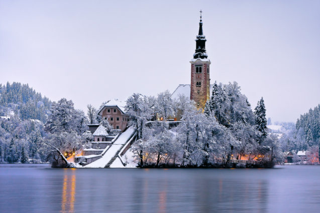 Bled Island covered with a layer of snow in the evening