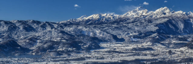 A wintry panorama of the Slovenian Alps with Lake Bled