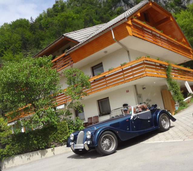 British guests visiting Fine Stay Apartments in Slovenia with a Morgan Roadster