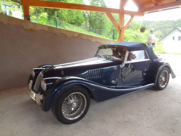 Morgan Roadster parked in a carport at Fine Stay Apartments in Slovenia