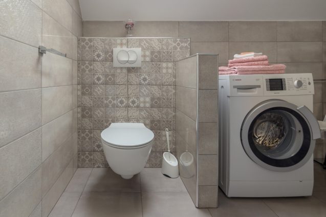 A toilet in the bathroom of Modern Apartment With Balcony, Apartments Fine Stay