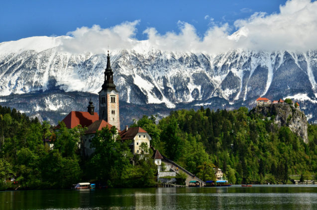 Bled Island in the spring with Karavanke Mountain Range in the background
