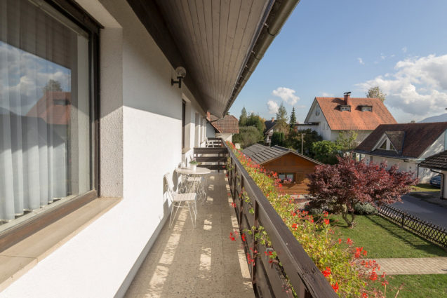 A balcony with garden view at Apartments Fine Stay Bled in Slovenia