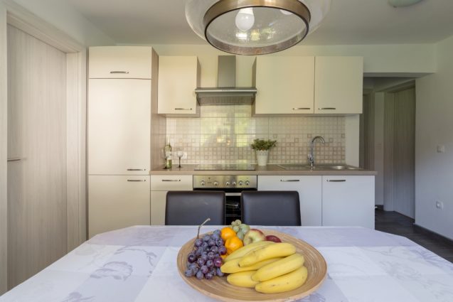 Kitchen and dining area of the Modern Apartment With Balcony and Terrace, Apartments Fine Stay, Lake Bled area of Slovenia