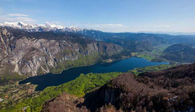 An aerial view of Lake Bohinj from Vogel Mountain in spring