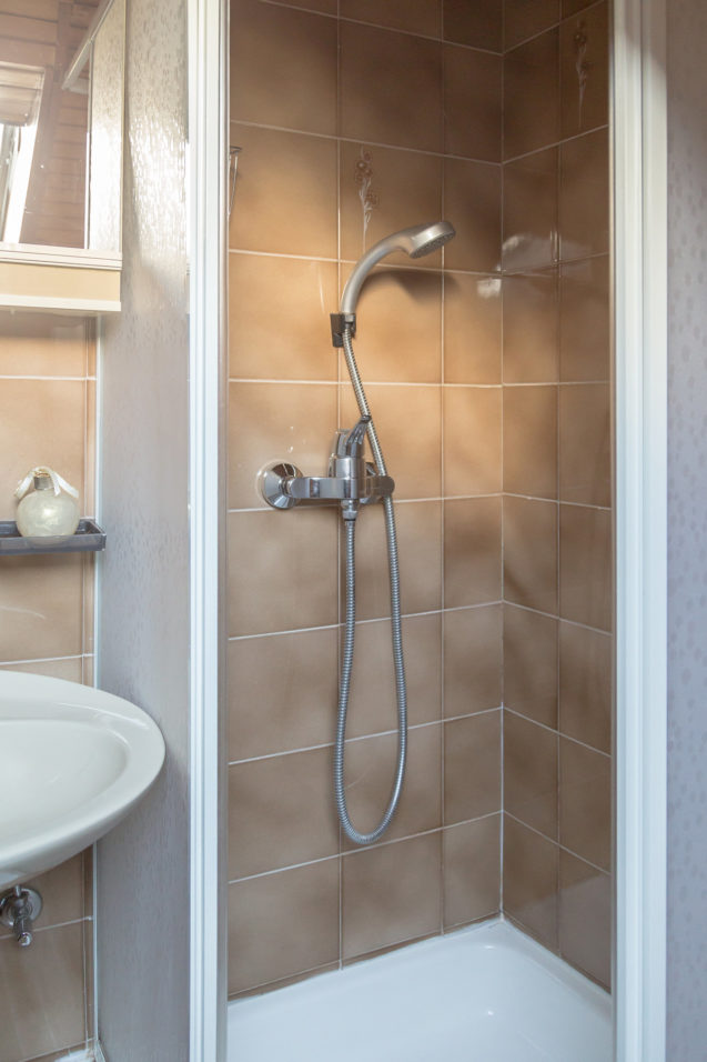 A shower in the loft Apartment at Apartments Fine Stay Bled in Lake Bled, Slovenia