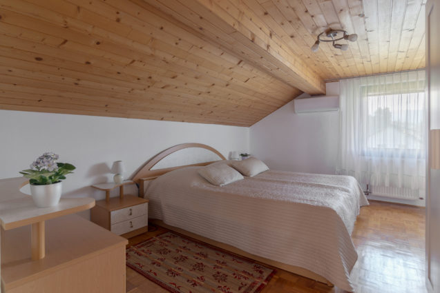 A bedroom in the loft Apartment at Apartments Fine Stay Bled in Lake Bled, Slovenia