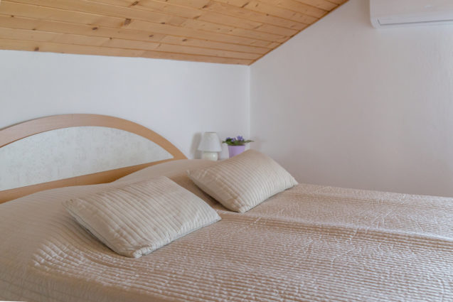 A bedroom in the loft Apartment at Apartments Fine Stay Bled in Lake Bled, Slovenia