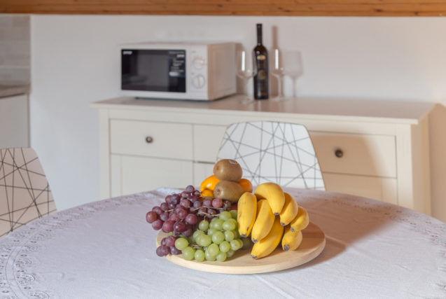 Fruits on a dining table in the loft Apartment at Apartments Fine Stay Bled