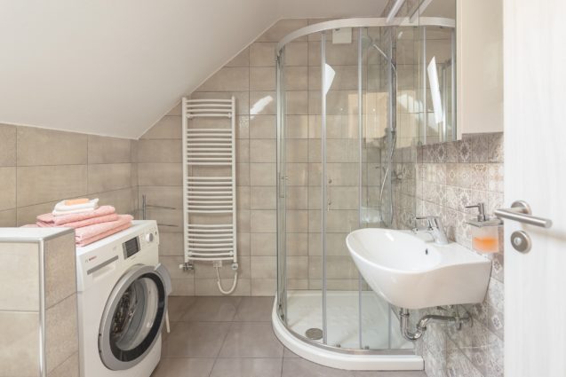 A glass shower stall in the bathroom of Modern Apartment With Balcony, Apartments Fine Stay