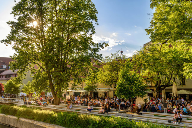 Al-fresco cafes next to Ljubljanica river canal in Ljubljana Old Town in the capital city of Slovenia