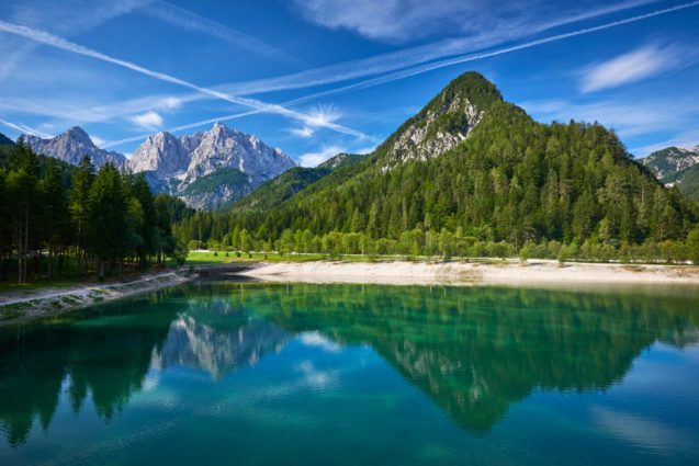 Lake Jasna in Kranjska Gora and mountains of Slovenian Alps in the background