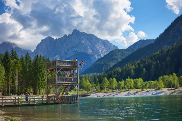 A three-level wooden diving platform which resembles a castle turret at Lake Jasna in Kranjska Gora, Slovenia