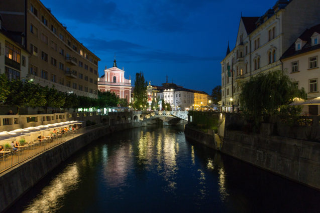 Ljubljanica River flowing through the center of Ljubljana at night