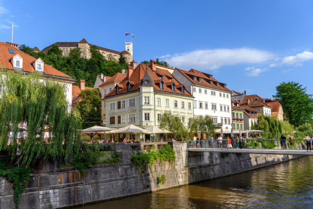 Ljubljanica River Canal and Ljubljana Castle in Ljubljana Old Town in summer