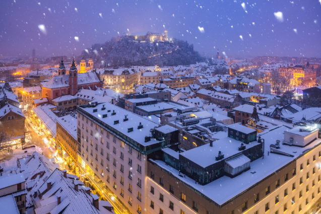 Ljubljana, the capital city of Slovenia in winter at night during snowfall