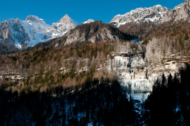 Frozen Pericnik Waterfall above Vrata Valley in winter