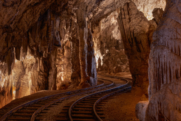 Train rails inside Postojna Cave in Slovenia