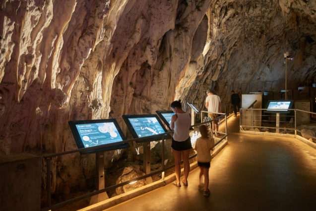 Info plaques inside Postojna Cave in Slovenia