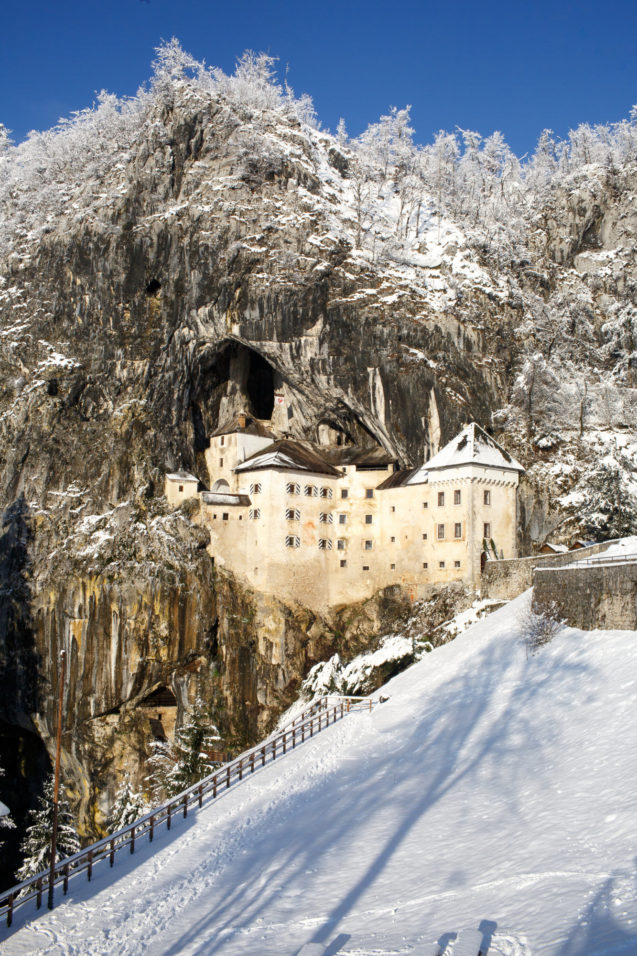 Predjama Castle blanketed with snow in winter