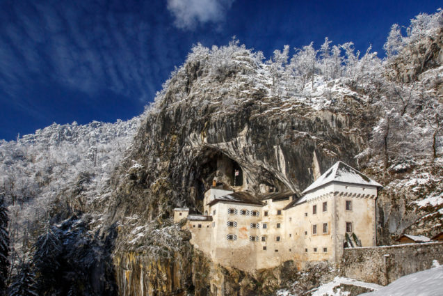 Predjama Castle near Postojna blanketed with snow in winter