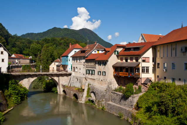 Medieval town of Skofja Loka in Slovenia with the Capuchin bridge across the Sora river in the background