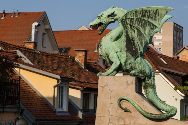 A statue of dragon on Dragon Bridge in Ljubljana, the capital city of Slovenia
