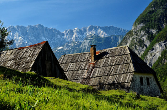 Traditional shingle roofed houses in Trenta Valley in Slovenia