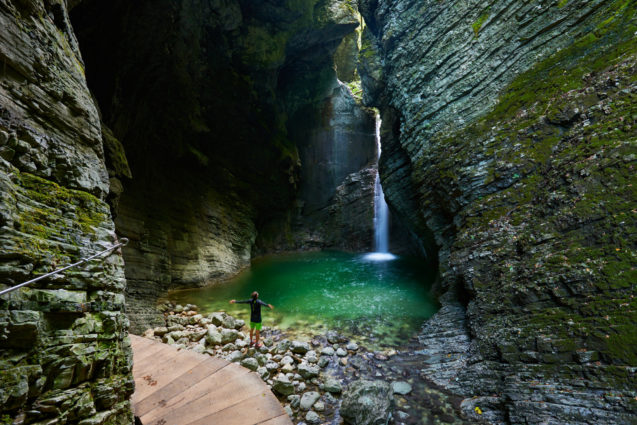 Wooden walkway and Kozjak Waterfall with a pool at its base