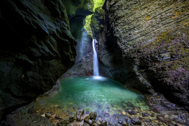 Kozjak Waterfall with an emerald green pool at its base