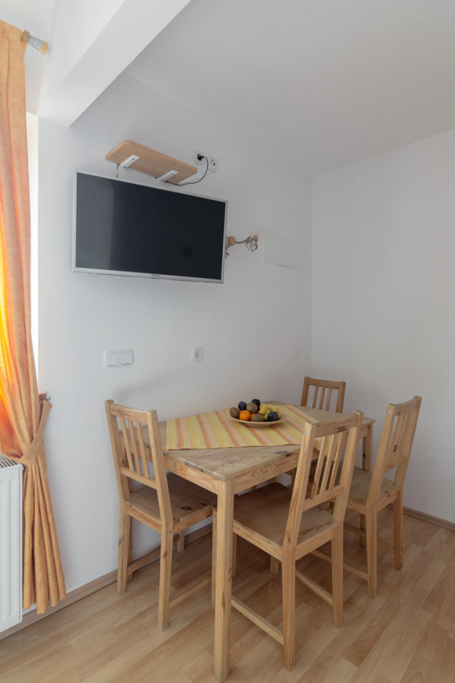 Dining table with 4 chairs in Cosy Apartment With Terrace at Apartments Valant Bled in Slovenia