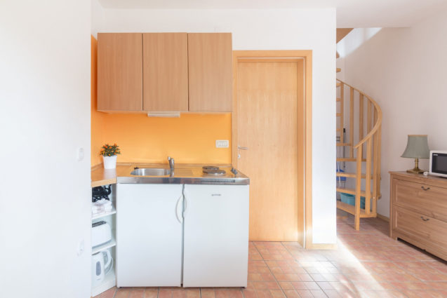 Kitchenette and spiral stairs in Duplex Apartment with Balcony at Apartments Valant Bled in Slovenia